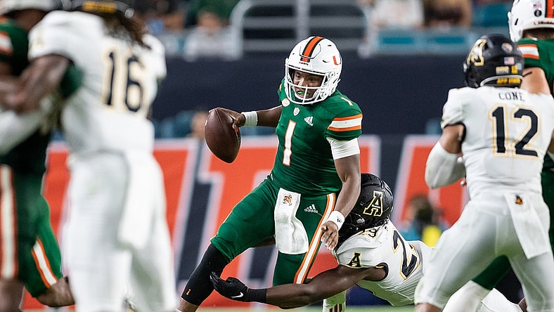 Sep 11, 2021; Miami Gardens, Florida, USA;  Miami Hurricanes quarterback D'Eriq King (1) is pressured by Appalachian State Mountaineers linebacker Brendan Harrington (29) during the second quarter at Hard Rock Stadium. Mandatory Credit: Richard Graulich-USA TODAY Sports
