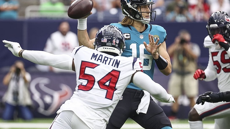Sep 12, 2021; Houston, Texas, USA; Jacksonville Jaguars quarterback Trevor Lawrence (16) attempts a pass during the first quarter against the Houston Texans at NRG Stadium. Mandatory Credit: Troy Taormina-USA TODAY Sports