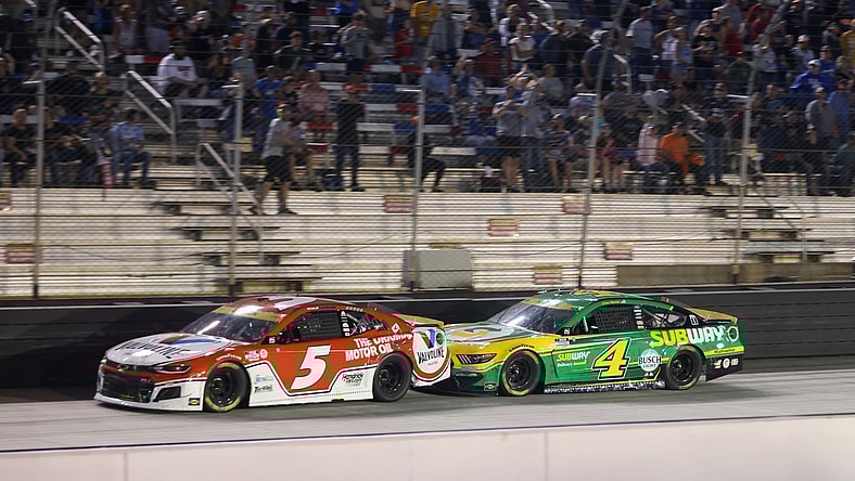 Sep 18, 2021; Bristol, Tennessee, USA; NASCAR Cup Series driver Kyle Larson (5) leads driver Kevin Harvick (4) at Bristol Motor Speedway. Mandatory Credit: Randy Sartin-USA TODAY Sports