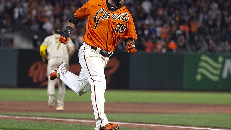 Oct 1, 2021; San Francisco, California, USA; San Francisco Giants shortstop Brandon Crawford (35) heads home on an RBI single by Mike Yastrzemski during the first inning against the San Diego Padres at Oracle Park. Mandatory Credit: D. Ross Cameron-USA TODAY Sports
