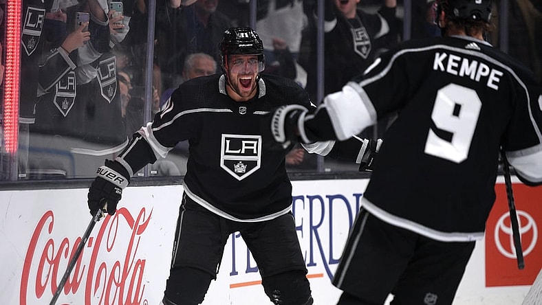 Oct 14, 2021; Los Angeles, California, USA; Los Angeles Kings center Anze Kopitar (11) celebrates with right wing Adrian Kempe (9) after scoring a goal during the second period against the Vegas Golden Knights at Staples Center. Mandatory Credit: Orlando Ramirez-USA TODAY Sports