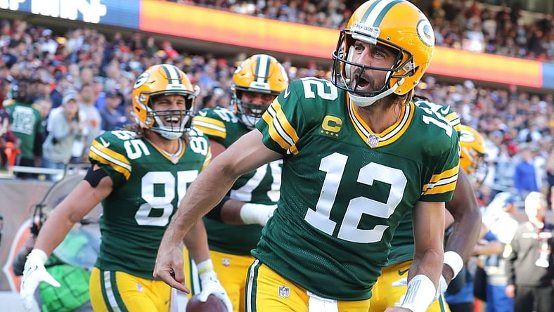 Aaron Rodgers celebrates his rushing touchdown during the fourth quarter against the Chicago Bears.Syndication Usa Today