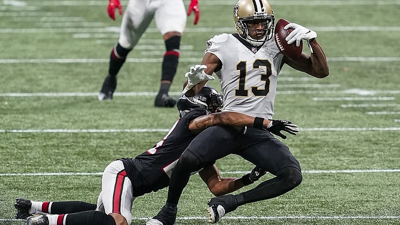 Dec 6, 2020; Atlanta, Georgia, USA; New Orleans Saints wide receiver Michael Thomas (13) holds on to the ball while being tackled by Atlanta Falcons cornerback A.J. Terrell (24) during the second half at Mercedes-Benz Stadium. Mandatory Credit: Dale Zanine-USA TODAY Sports