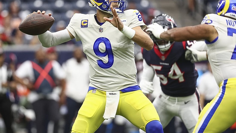 Oct 31, 2021; Houston, Texas, USA; Los Angeles Rams quarterback Matthew Stafford (9) attempts a pass during the first quarter against the Houston Texans at NRG Stadium. Mandatory Credit: Troy Taormina-USA TODAY Sports