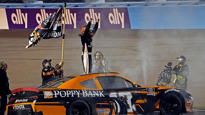 Nov 6, 2021; Phoenix, AZ, USA; Xfinity Series driver Daniel Hemric (18) celebrates winning the Xfinity Series Championship at Phoenix Raceway. Mandatory Credit: Peter Casey-USA TODAY Sports