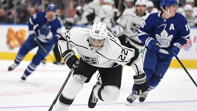 Nov 8, 2021; Toronto, Ontario, CAN; Los Angeles Kings forward Andreas Athanasiou (22) rushes the puck up ice en route to scoring a goal against Toronto Maple Leafs in the first period at Scotiabank Arena. Mandatory Credit: Dan Hamilton-USA TODAY Sports