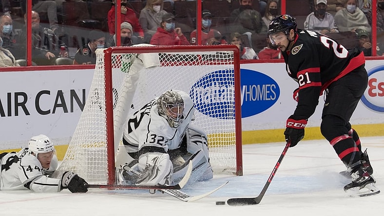 Nov 11, 2021; Ottawa, Ontario, CAN; Ottawa Senators left wing Nick Paul (21) steals the puck away from Los Angeles Kings goalie Jonathan Quick (32) as defenseman Mikey Anderson (44) defends in the second period at the Canadian Tire Centre. Mandatory Credit: Marc DesRosiers-USA TODAY Sports