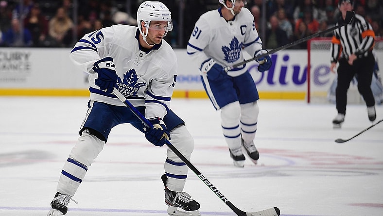 Nov 28, 2021; Anaheim, California, USA; Toronto Maple Leafs center Alexander Kerfoot (15) controls the puck against the Anaheim Ducks during the second period at Honda Center. Mandatory Credit: Gary A. Vasquez-USA TODAY Sports
