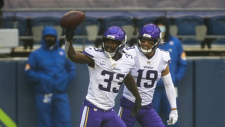 Oct 11, 2020; Seattle, Washington, USA; Minnesota Vikings running back Dalvin Cook (33) celebrates with wide receiver Adam Thielen (19) after rushing for a touchdown against the Seattle Seahawks during the first quarter at CenturyLink Field. Mandatory Credit: Joe Nicholson-USA TODAY Sports