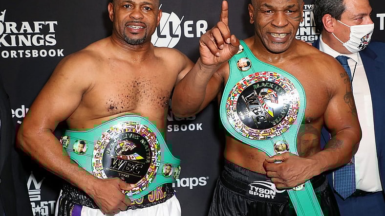 Nov 28, 2020; Los Angeles, CA, USA;  Mike Tyson and Roy Jones, Jr. pose with their belts after a split draw during a heavyweight exhibition boxing bout for the WBC Frontline Belt at the Staples Center.  Mandatory Credit: Joe Scarnici/Handout Photo via USA TODAY Sports