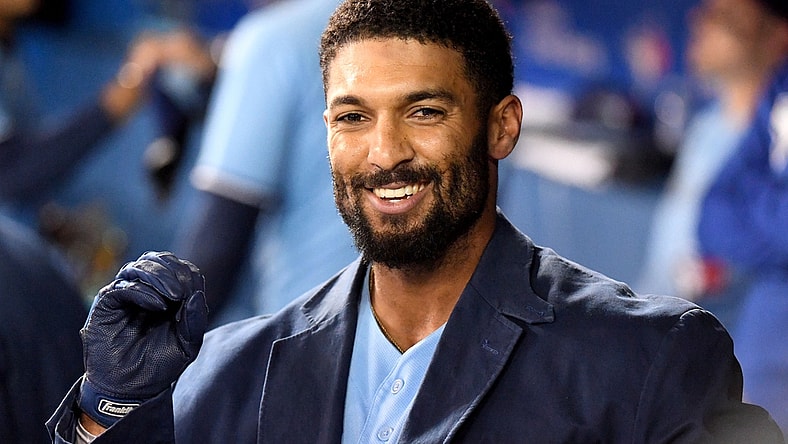 Sep 29, 2021; Toronto, Ontario, CAN; Toronto Blue Jays second baseman Marcus Semien (10) wears the team home run jacket in the dugout after hitting a two-run home run against New York Yankees in the first inning at Rogers Centre. Mandatory Credit: Dan Hamilton-USA TODAY Sports