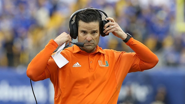 Oct 30, 2021; Pittsburgh, Pennsylvania, USA; Miami Hurricanes head coach Manny Diaz puts his headset on against the Pittsburgh Panthers during the fourth quarter at Heinz Field. Mandatory Credit: Charles LeClaire-USA TODAY Sports