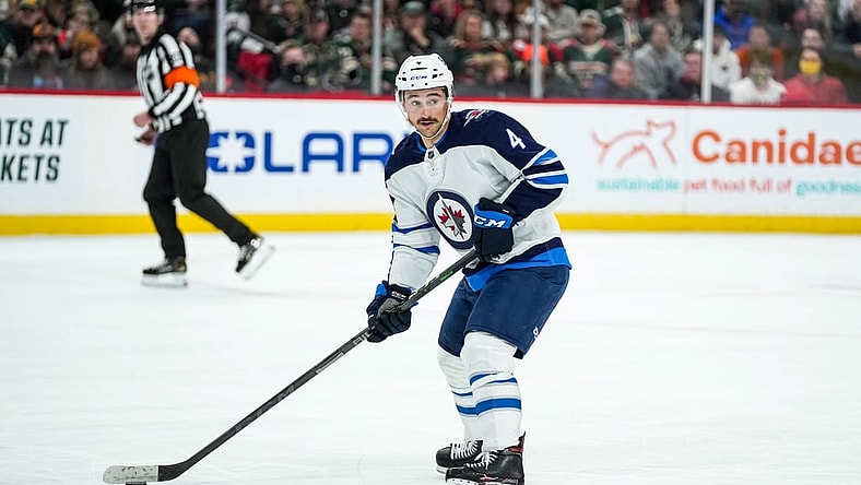 Nov 26, 2021; Saint Paul, Minnesota, USA; Winnipeg Jets defenseman Neal Pionk (4) during a game between the Minnesota Wild and Winnipeg Jets at Xcel Energy Center. Mandatory Credit: Brace Hemmelgarn-USA TODAY Sports