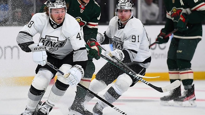 Dec 11, 2021; Los Angeles, California, USA; Los Angeles Kings left wing Brendan Lemieux (48) and Minnesota Wild left wing Kirill Kaprizov (97) chase down the puck in the third period of the game at Staples Center. Mandatory Credit: Jayne Kamin-Oncea-USA TODAY Sports
