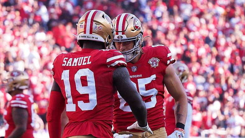 Nov 28, 2021; Santa Clara, California, USA; San Francisco 49ers wide receiver Deebo Samuel (19) celebrates with tight end George Kittle (85) after scoring a touchdown against the Minnesota Vikings during the first quarter at Levi's Stadium. Mandatory Credit: Kelley L Cox-USA TODAY Sports
