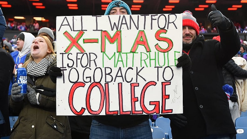 Dec 19, 2021; Orchard Park, New York, USA; Carolina Panthers fans hold a sign for Carolina Panthers head coach Matt Rhule (not pictured) against the Buffalo Bills during the second half at Highmark Stadium. Mandatory Credit: Rich Barnes-USA TODAY Sports