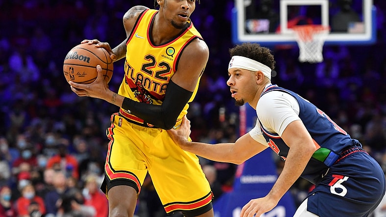 Dec 23, 2021; Philadelphia, Pennsylvania, USA; Atlanta Hawks forward Cam Reddish (22) is defended by Philadelphia 76ers guard Seth Curry (31) during the first quarter at Wells Fargo Center. Mandatory Credit: Eric Hartline-USA TODAY Sports