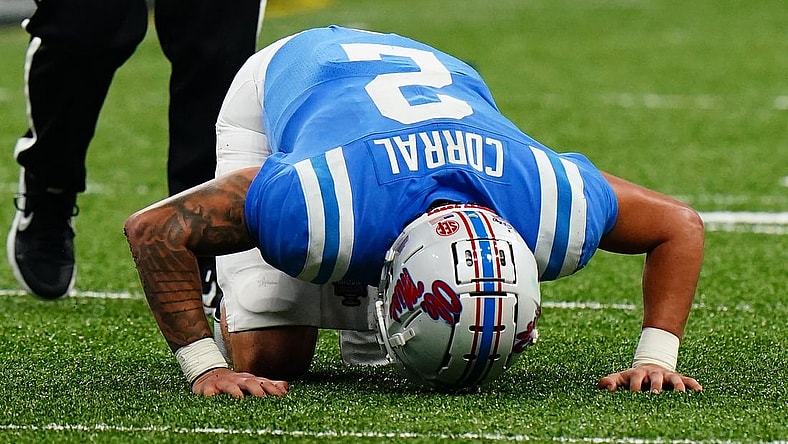 Jan 1, 2022; New Orleans, LA, USA; Mississippi Rebels quarterback Matt Corral (2) reacts after an apparent injury while being sacked by Baylor Bears defensive tackle Cole Maxwell (not pictured) during the first half in the 2022 Sugar Bowl at Caesars Superdome. Mandatory Credit: John David Mercer-USA TODAY Sports