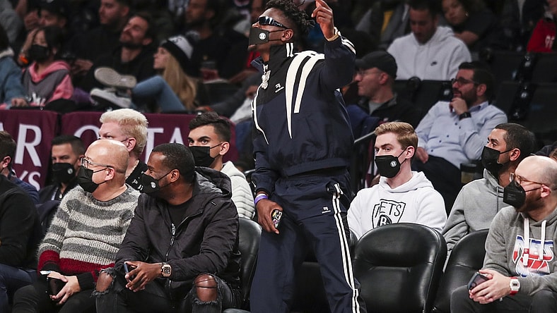 Jan 3, 2022; Brooklyn, New York, USA;  Former NFL wide receiver Antonio Brown cheers during the game between the Memphis Grizzlies and Brooklyn Nets at Barclays Center. Mandatory Credit: Wendell Cruz-USA TODAY Sports