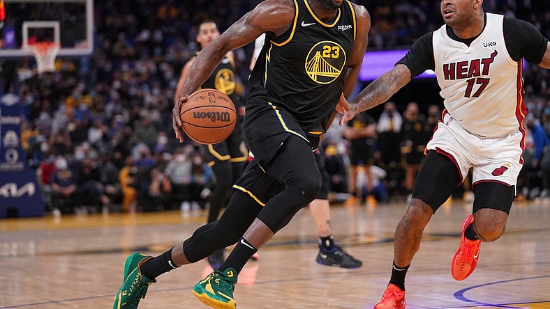 Jan 3, 2022; San Francisco, California, USA; Golden State Warriors forward Draymond Green (23) drives past Miami Heat forward P.J. Tucker (17) in the fourth quarter at the Chase Center. Mandatory Credit: Cary Edmondson-USA TODAY Sports