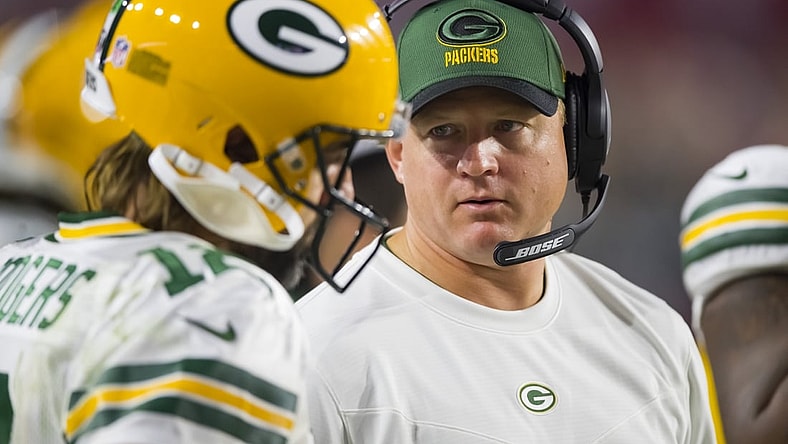 Oct 28, 2021; Glendale, Arizona, USA; Green Bay Packers quarterbacks coach Luke Getsy talks to Aaron Rodgers (12) against the Arizona Cardinals at State Farm Stadium. Mandatory Credit: Mark J. Rebilas-USA TODAY Sports
