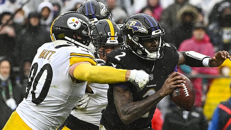 Jan 9, 2022; Baltimore, Maryland, USA;  Pittsburgh Steelers outside linebacker T.J. Watt (90) and outside linebacker Alex Highsmith (56) sack sBaltimore Ravens quarterback Tyler Huntley (2) during the second  quarter at M&T Bank Stadium. Mandatory Credit: Tommy Gilligan-USA TODAY Sports