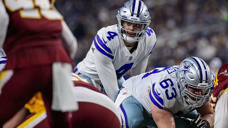 Dec 26, 2021; Arlington, Texas, USA; Dallas Cowboys quarterback Dak Prescott (4) and center Tyler Biadasz (63) in action during the game between the Washington Football Team and the Dallas Cowboys at AT&T Stadium. Mandatory Credit: Jerome Miron-USA TODAY Sports
