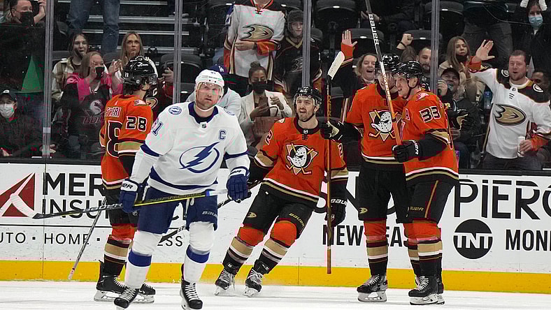 Jan 21, 2022; Anaheim, California, USA; Anaheim Ducks center Derek Grant (38) celebrates with teammates defenseman Kevin Shattenkirk (22), center Derek Grant (38) and right wing Jakob Silfverberg (33) after scoring a goal against the Tampa Bay Lightning  in the second period at Honda Center. Mandatory Credit: Kirby Lee-USA TODAY Sports