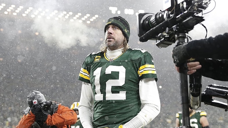Jan 22, 2022; Green Bay, Wisconsin, USA; Green Bay Packers quarterback Aaron Rodgers (12) reacts while leaving the field after an NFC Divisional playoff football game against the San Francisco 49ers at Lambeau Field. Mandatory Credit: Jeff Hanisch-USA TODAY Sports