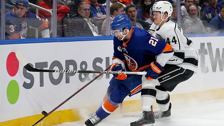 Jan 27, 2022; Elmont, New York, USA; Los Angeles Kings defenseman Mikey Anderson (44) hits New York Islanders right wing Kyle Palmieri (21) during the second period at UBS Arena. Mandatory Credit: Brad Penner-USA TODAY Sports