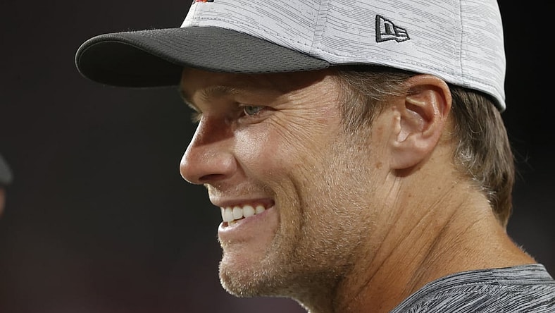 Aug 21, 2021; Tampa, Florida, USA; Tampa Bay Buccaneers quarterback Tom Brady (12) smiles on the sidelines during the second quarter against the Tennessee Titans at Raymond James Stadium. Mandatory Credit: Kim Klement-USA TODAY Sports