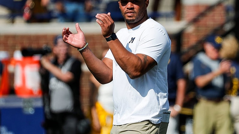 Michigan offensive coordinator Josh Gattis watches warmups before a game against Northern Illinois at Michigan Stadium in Ann Arbor on Saturday, Sept. 18, 2021.