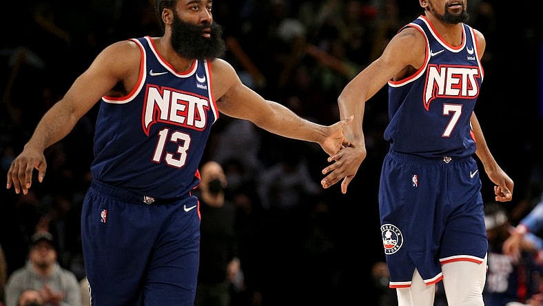 Dec 3, 2021; Brooklyn, New York, USA; Brooklyn Nets forward Kevin Durant (7) celebrates with guard James Harden (13) after a basket against the Minnesota Timberwolves during the fourth quarter at Barclays Center. Mandatory Credit: Brad Penner-USA TODAY Sports