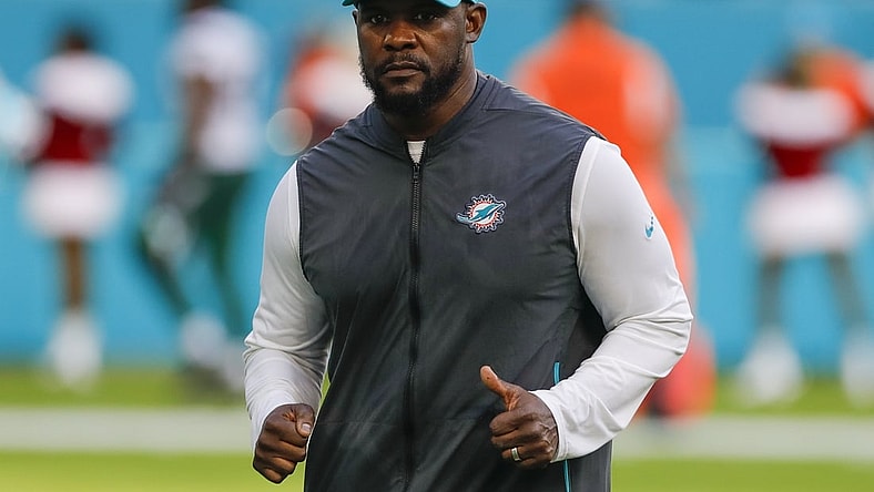 Dec 19, 2021; Miami Gardens, Florida, USA; Miami Dolphins head coach Brian Flores runs off the field after winning the game against the New York Jets at Hard Rock Stadium. Mandatory Credit: Sam Navarro-USA TODAY Sports