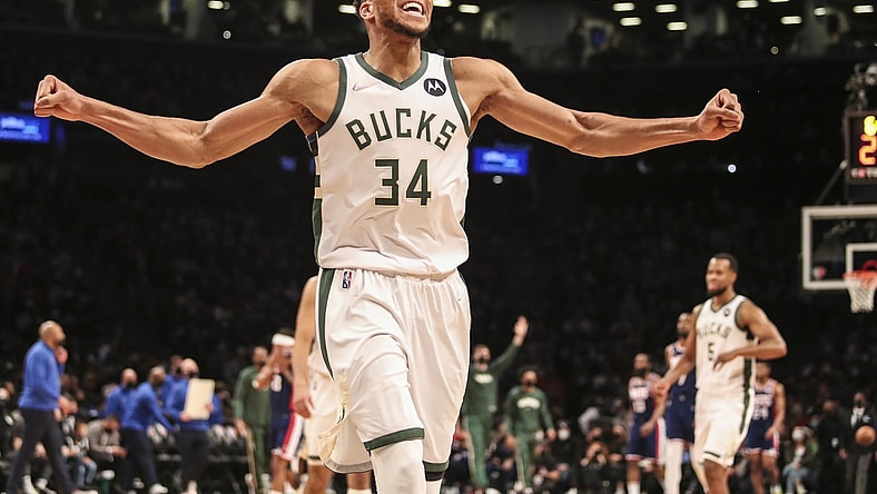 Jan 7, 2022; Brooklyn, New York, USA; Milwaukee Bucks forward Giannis Antetokounmpo (34) celebrates after the Brooklyn Nets call a time out in the fourth quarter at Barclays Center. Mandatory Credit: Wendell Cruz-USA TODAY Sports