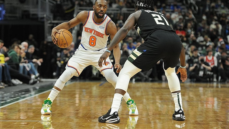 Jan 28, 2022; Milwaukee, Wisconsin, USA; New York Knicks guard Kemba Walker (8) brings the ball up the court against Milwaukee Bucks guard Jrue Holiday (21) in the second half at Fiserv Forum. Mandatory Credit: Michael McLoone-USA TODAY Sports
