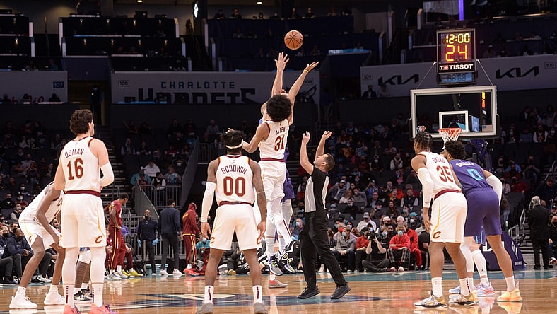 Feb 4, 2022; Charlotte, North Carolina, USA; Cleveland Cavaliers center Jarrett Allen (31) and Charlotte Hornets center Mason Plumlee (24) tip off the game at the Spectrum Center. Mandatory Credit: Sam Sharpe-USA TODAY Sports