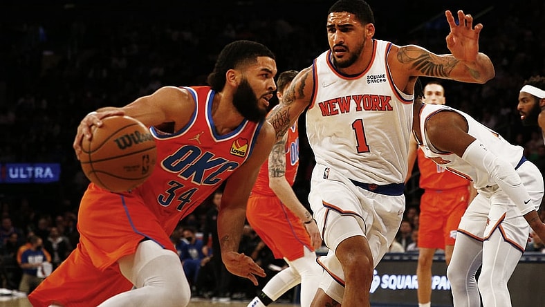 Feb 14, 2022; New York, New York, USA; Oklahoma City Thunder forward Kenrich Williams (34) dribbles the ball against New York Knicks forward Obi Toppin (1) during the first half at Madison Square Garden. Mandatory Credit: Andy Marlin-USA TODAY Sports