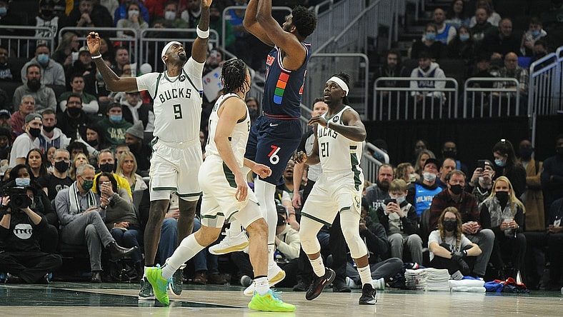 Feb 17, 2022; Milwaukee, Wisconsin, USA;  Philadelphia 76ers center Joel Embiid (21) puts up a shot against Milwaukee Bucks center Bobby Portis (9) in the first quarter at Fiserv Forum. Mandatory Credit: Michael McLoone-USA TODAY Sports
