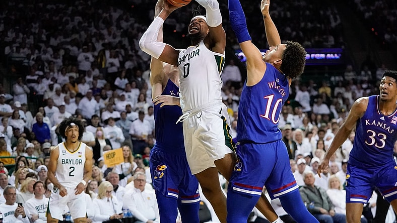 Feb 26, 2022; Waco, Texas, USA;  Baylor Bears forward Flo Thamba (0) shoots against Kansas Jayhawks forward Jalen Wilson (10) during the first half at Ferrell Center. Mandatory Credit: Chris Jones-USA TODAY Sports