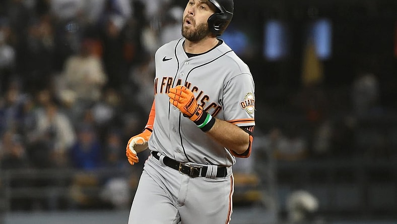 Oct 11, 2021; Los Angeles, California, USA; San Francisco Giants third baseman Evan Longoria (10) celebrates after hitting a solo home run against the Los Angeles Dodgers in the fifth inning during game three of the 2021 NLDS at Dodger Stadium. Mandatory Credit: Richard Mackson-USA TODAY Sports