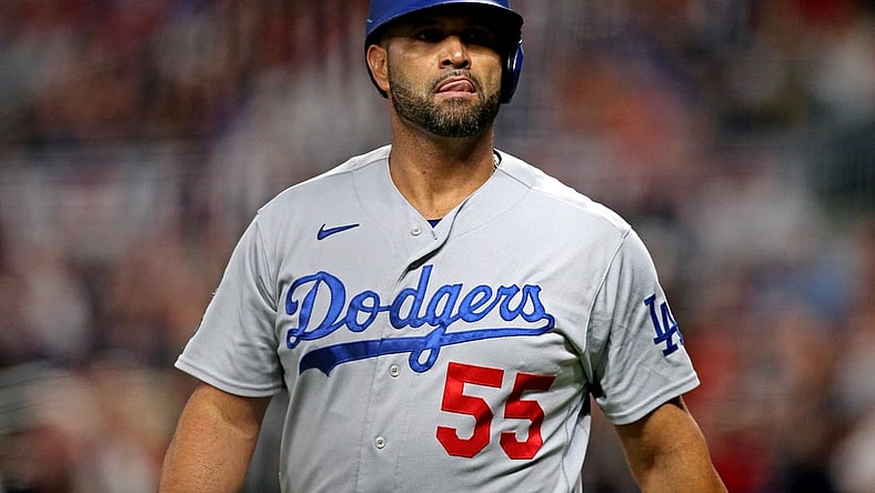 Oct 23, 2021; Cumberland, Georgia, USA; Los Angeles Dodgers first baseman Albert Pujols (55) reacts during the fourth inning against the Atlanta Braves in game six of the 2021 NLCS at Truist Park. Mandatory Credit: Brett Davis-USA TODAY Sports