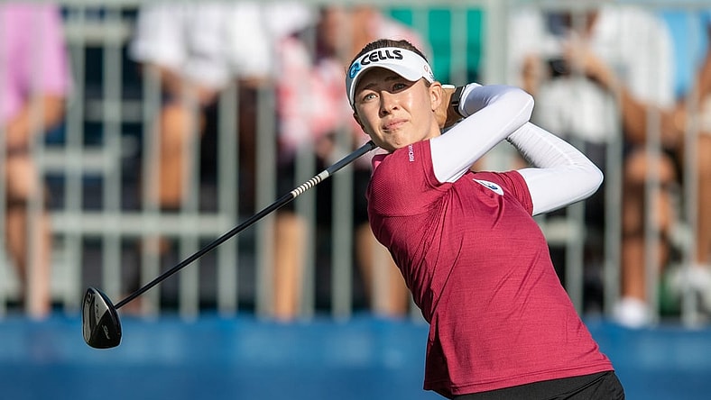Dec 16, 2021; Orlando, Florida, USA; Nelly Korda plays her shot from the first tee during a pro-am round of the PNC Championship golf tournament at Grande Lakes Orlando Course. Mandatory Credit: Jeremy Reper-USA TODAY Sports