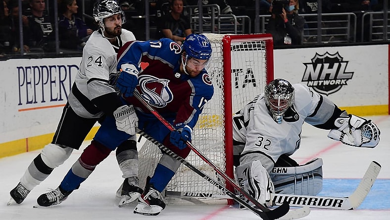 Jan 20, 2022; Los Angeles, California, USA; Colorado Avalanche center Tyson Jost (17) moves in for a shot on goal against Los Angeles Kings goaltender Jonathan Quick (32) and center Phillip Danault (24) during the third period at Crypto.com Arena. Mandatory Credit: Gary A. Vasquez-USA TODAY Sports