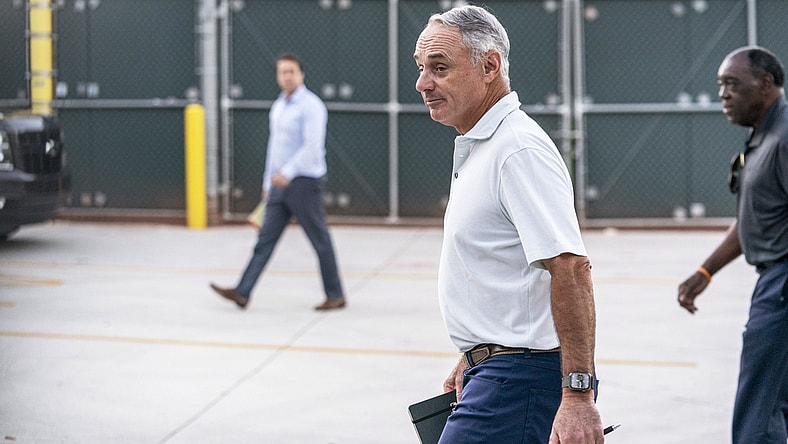 Feb 28, 2022; Jupiter, FL, USA; Major League Baseball Commissioner Rob Manfred, center, walks after negotiations with the players association in an attempt to reach an agreement to salvage March 31 openers and a 162-game season, Monday, Feb. 28, 2022, at Roger Dean Stadium in Jupiter, Fla. Mandatory Credit: Greg Lovett-USA TODAY NETWORK