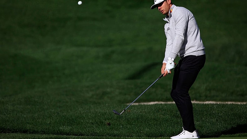 Sam Burns chips on 5 of the Players Stadium Course Sunday, March 13, 2022 at TPC Sawgrass in Ponte Vedra Beach. Sunday marked finishing second rounds and beginning third rounds of golf for The Players Championship.

Jki 031422 Playerssuncorey 37