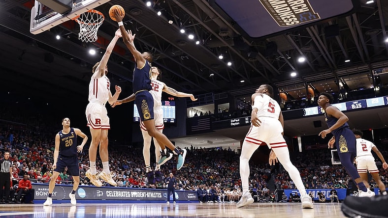 Mar 16, 2022; Dayton, Ohio, USA; Notre Dame Fighting Irish guard Blake Wesley (0) shoots the ball defended by Rutgers Scarlet Knights guard Jalen Miller (2) in the first half at University of Dayton Arena. Mandatory Credit: Rick Osentoski-USA TODAY Sports