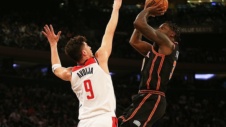 Mar 18, 2022; New York, New York, USA; New York Knicks forward Julius Randle (30) takes a shot against Washington Wizards forward Deni Avdija (9) during the second half at Madison Square Garden. Mandatory Credit: Andy Marlin-USA TODAY Sports