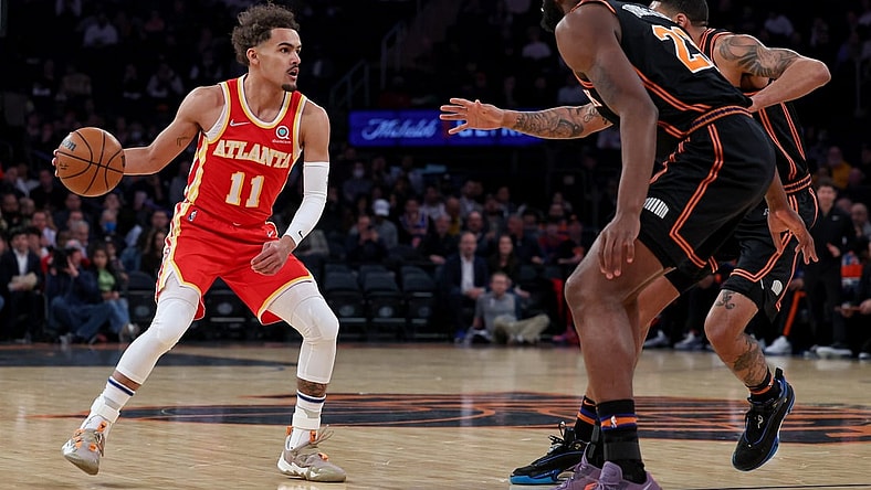Mar 22, 2022; New York, New York, USA; Atlanta Hawks guard Trae Young (11) dribbles against New York Knicks center Mitchell Robinson (23) and forward Obi Toppin (1) during the first quarter at Madison Square Garden. Mandatory Credit: Vincent Carchietta-USA TODAY Sports
