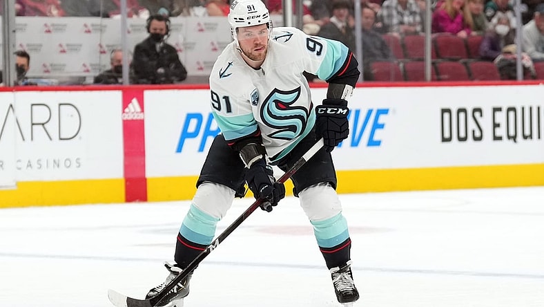 Mar 22, 2022; Glendale, Arizona, USA; Seattle Kraken right wing Daniel Sprong (91) skates with the puck against the Arizona Coyotes during the second period at Gila River Arena. Mandatory Credit: Joe Camporeale-USA TODAY Sports